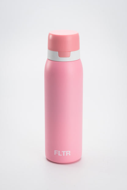 Pink alkaline filter water bottle, stainless steel and BPA-free. Ideal for on-the-go hydration with advanced filtration for alkaline water, promoting improved pH balance and reduced impurities. Perfect for active lifestyles and travel